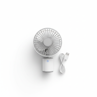 Compact portable mini USB fan on white background